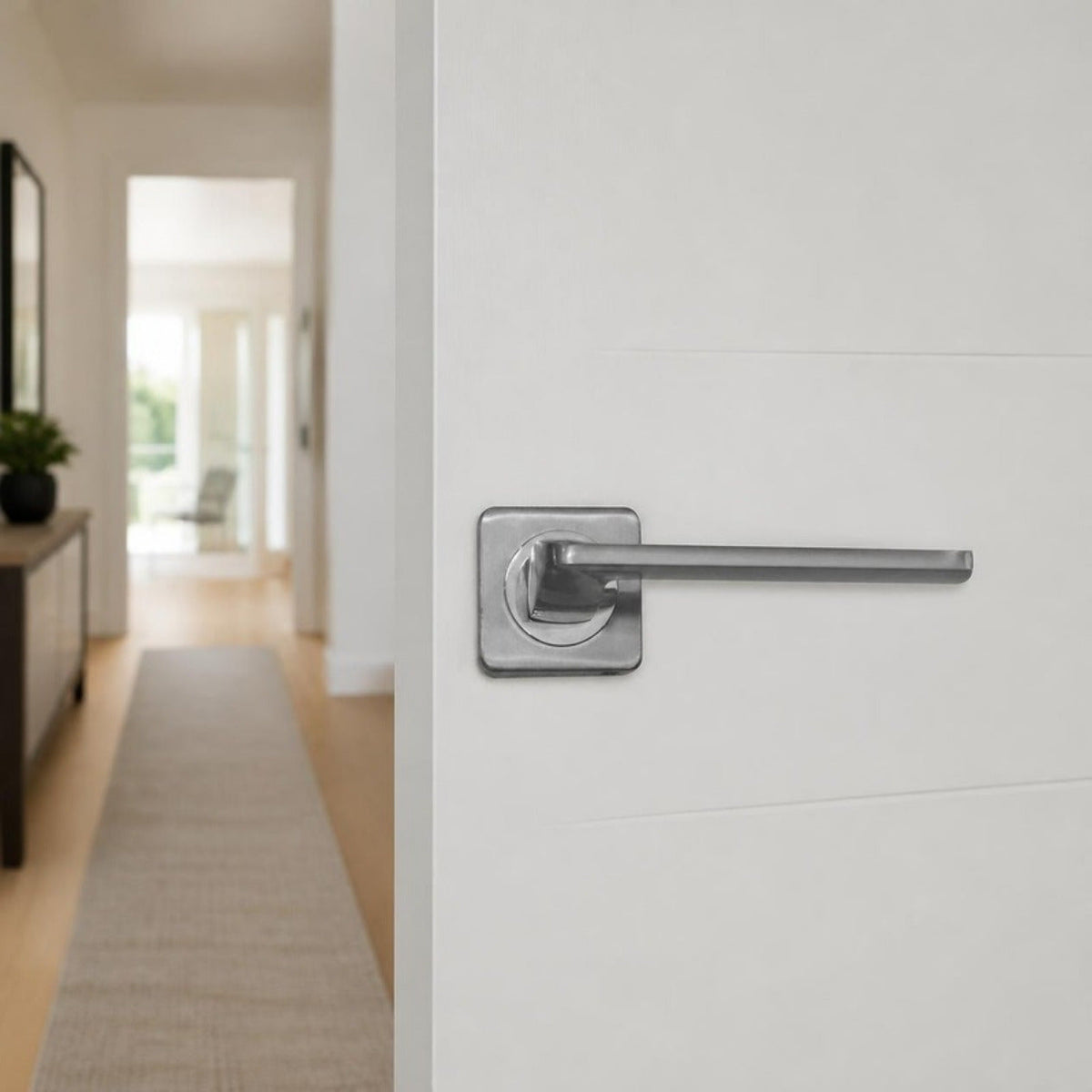 Lever handle on square rose