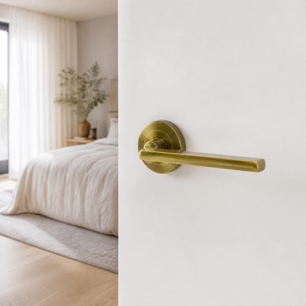 Cortina Door Handle on Rose - Antique Brass