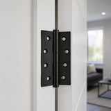 Matt black butt hinge 100x75mm on a white interior door