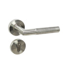 Knurled door handle on rose in brushed stainless steel