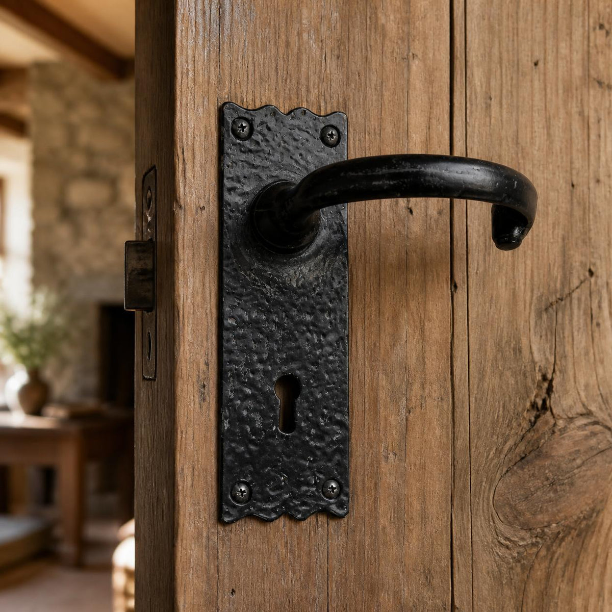 Wrought iron lever handle on plate