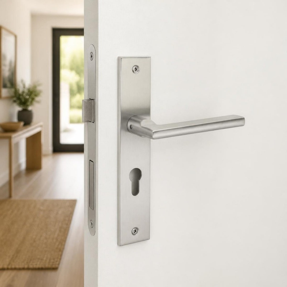 Modern Brushed Stainless Steel Lever Handle on Plate — Cylinder Keyhole