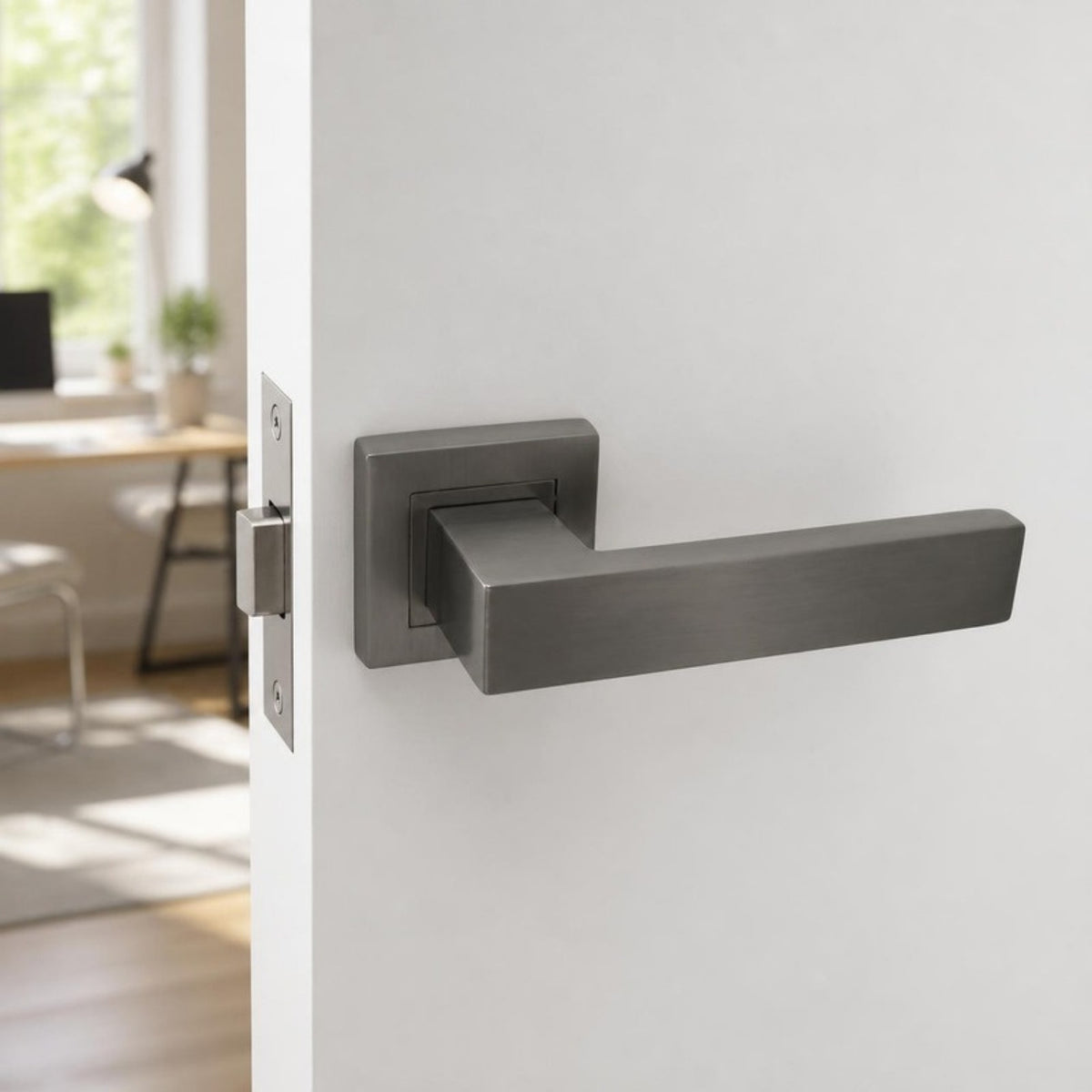 Square stainless steel lever handle on rose