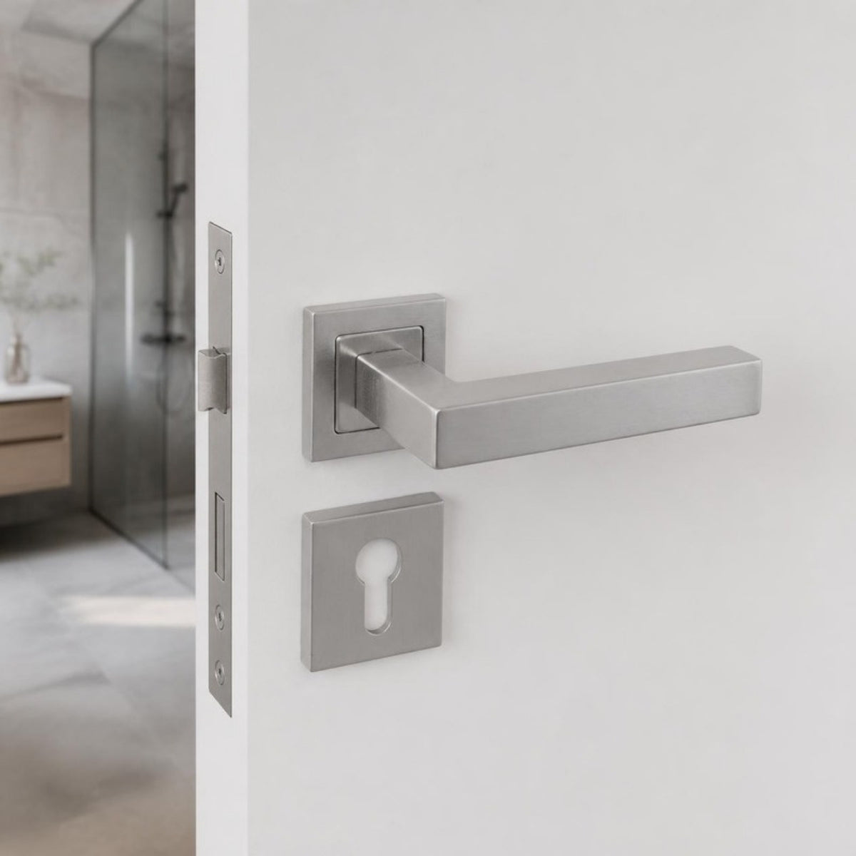 Square stainless steel lever handle on rose