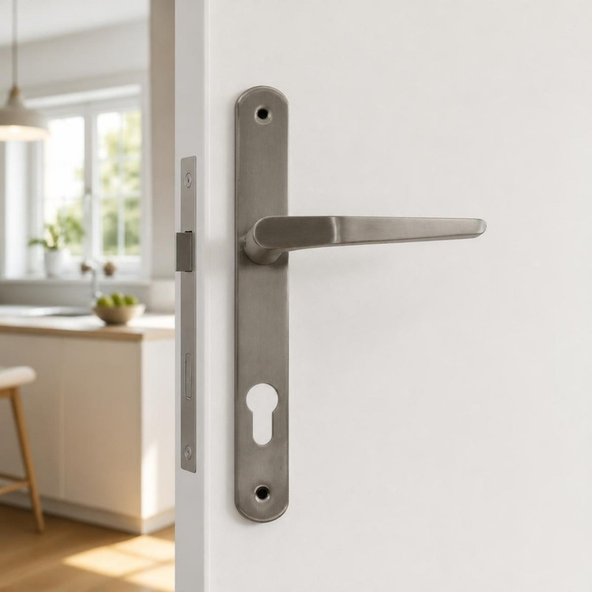 Narrow stainless steel lever handle on plate