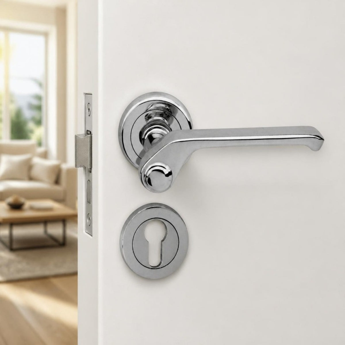 Shiny chrome designer door handle on rose