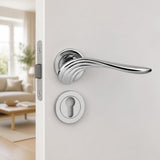 Curved "swan" lever handle on rose