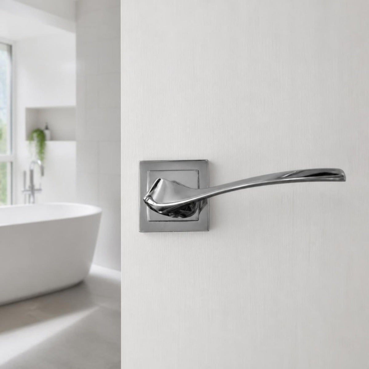 Shiny chrome designer lever handle on square rose