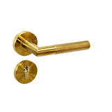 Modern knurled door handle on rose in matt brass