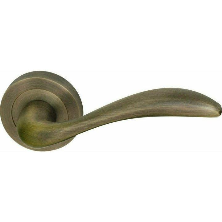 Curved lever handle on rose